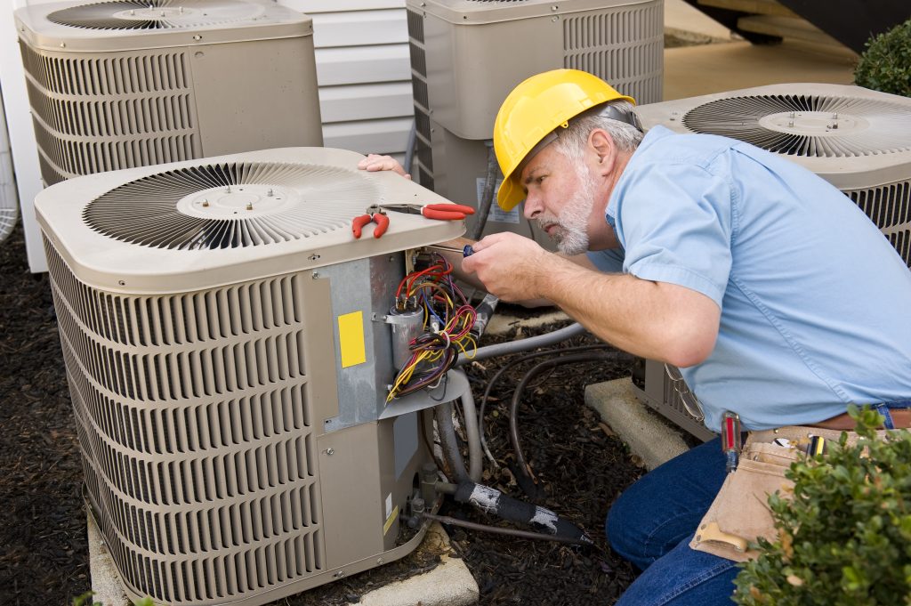 Repairman,Works,On,Air,Conditioner,Horizontal,Shot