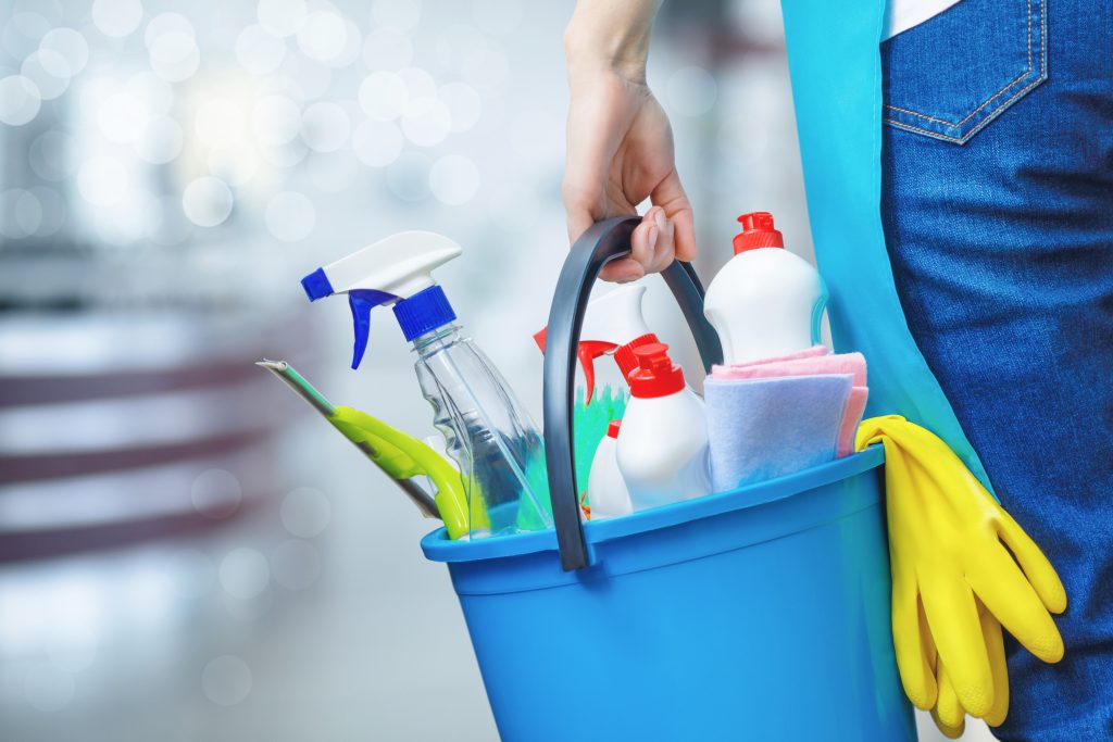 Cleaning,Lady,Holding,A,Bucket,Of,Cleaning,Products,In,Her